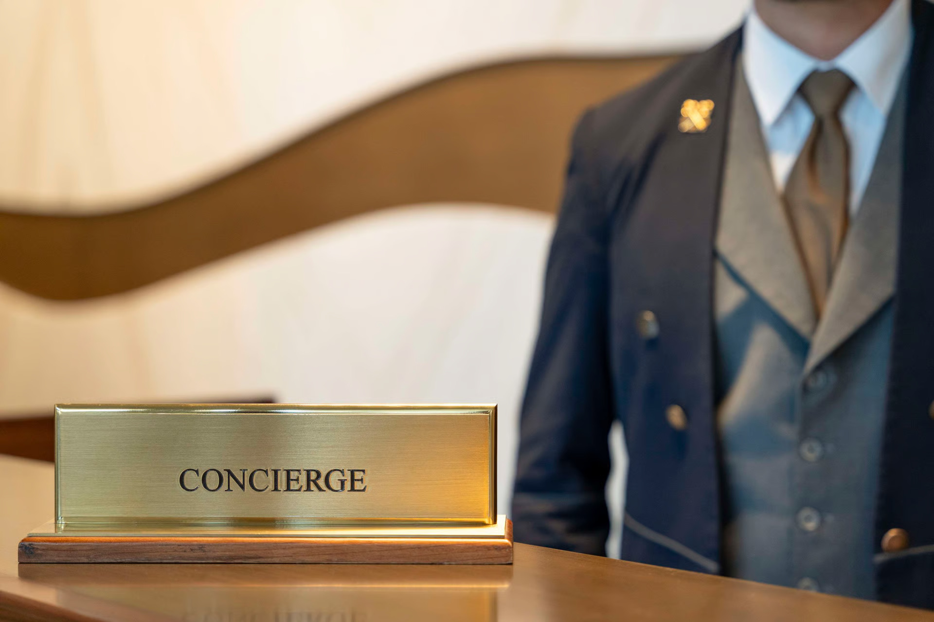 Concierge assisting guest at a hotel desk